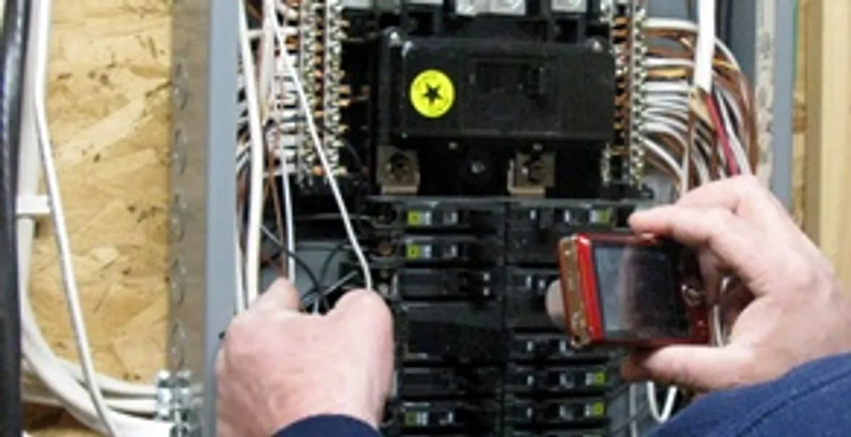 Home electrical inspection of circuit breaker panel by licensed electrician in Birmingham, AL