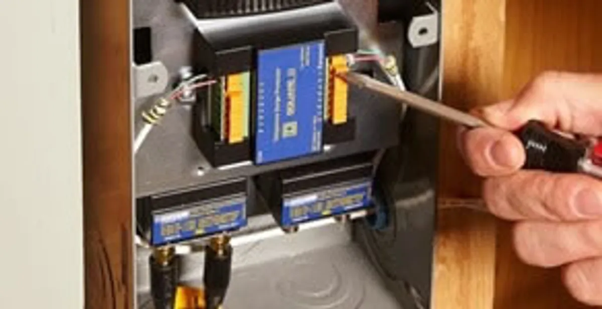 Whole home surge protection device being installed by a licensed electrician to protect electrical systems in Birmingham, AL